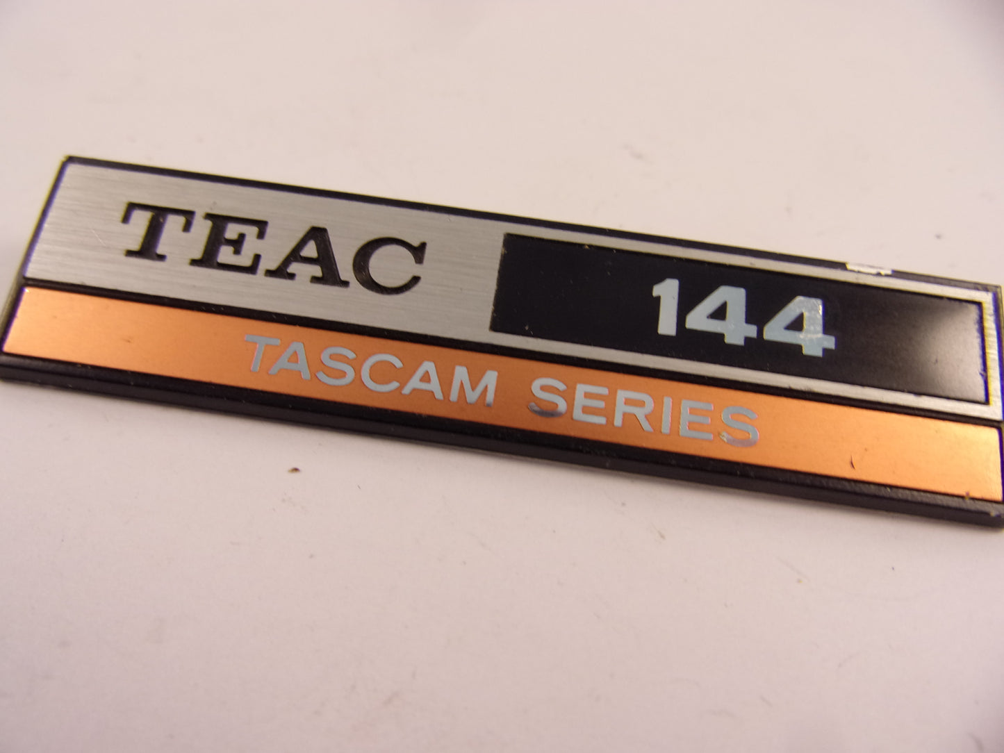 Tascam 144 badge